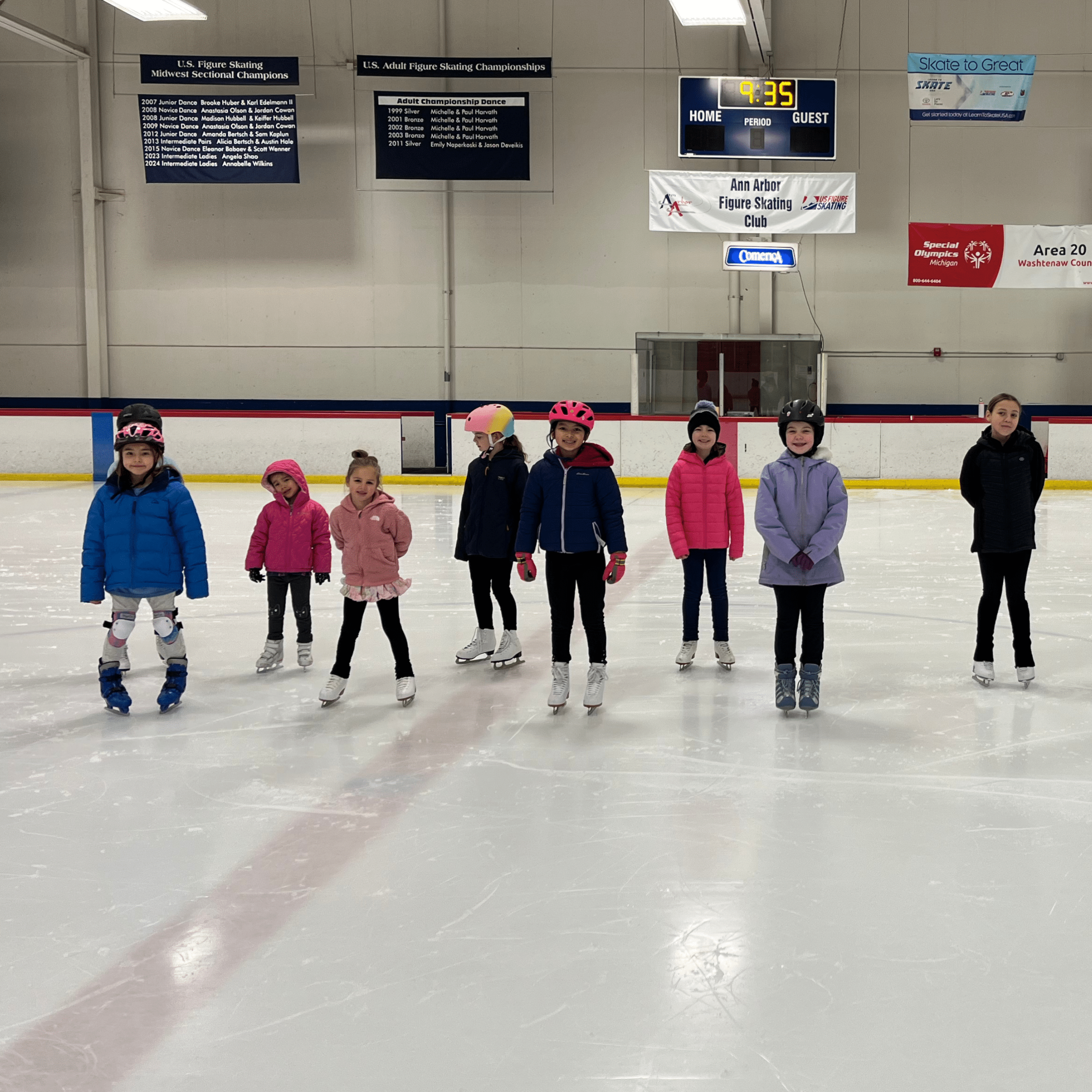 Ice skaters posing on ice